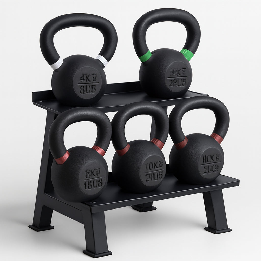 Set of black kettlebells on a black stand with weight markings on a white background