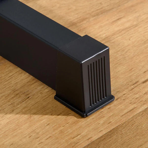 Black metal bracket on a wooden surface