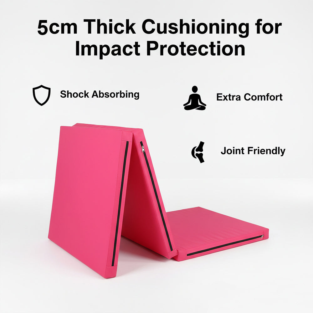 Pink mat with text about 6cm thick cushioning for impact protection, shock absorption, extra comfort, and joint friendliness on a white background.