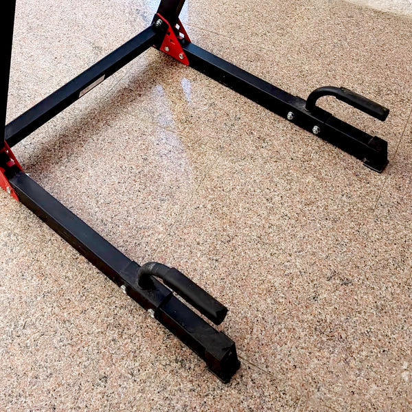 Black metal car jack stand on a concrete surface