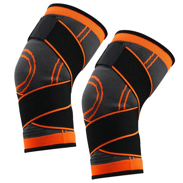 Pair of black and orange knee sleeves on a white background