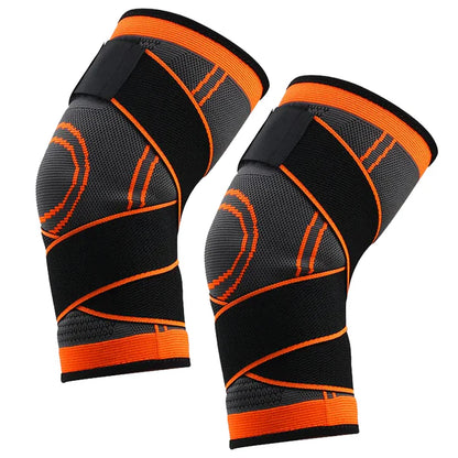 Pair of black and orange knee sleeves on a white background
