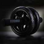 Black exercise wheel on a dark background