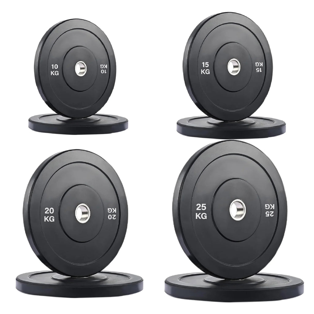 Set of four weight plates with labeled weights on a white background