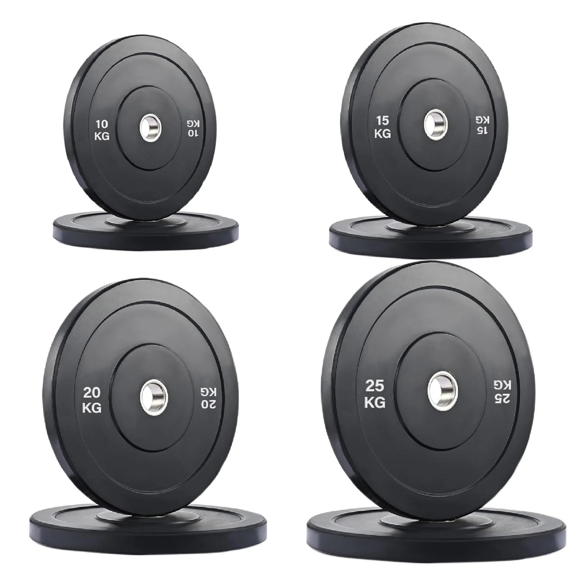 Set of four weight plates with labeled weights on a white background