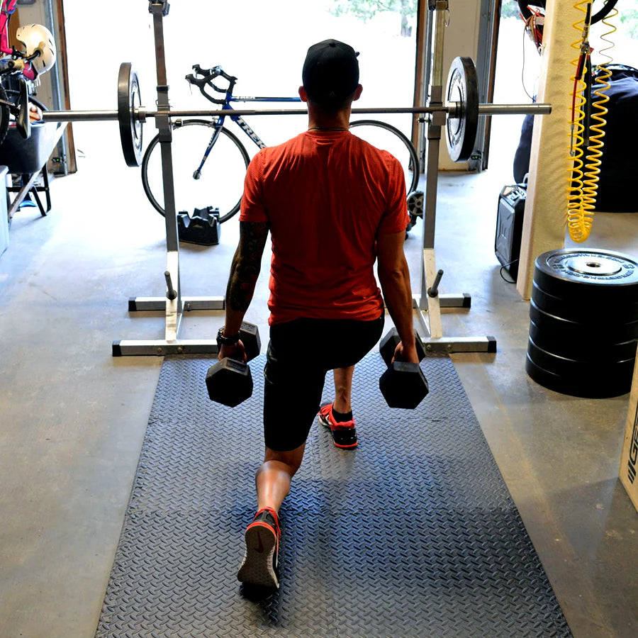 Person walking with dumbbells in a gym setting