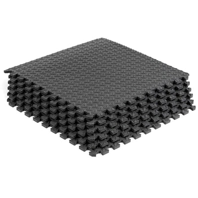 Stack of gray interlocking foam mats on a white background