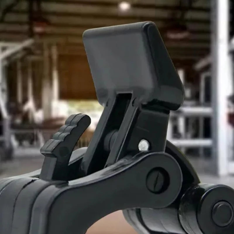 Close-up of a black metal lever or handle in an indoor setting with blurred background