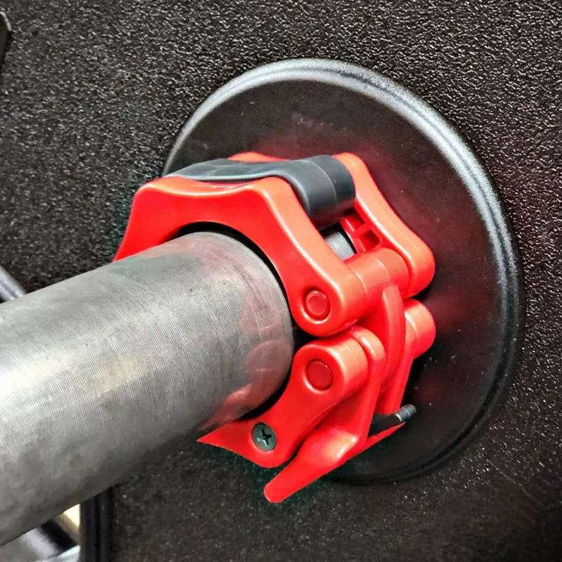 Red fuel pump handle attached to a black fuel nozzle
