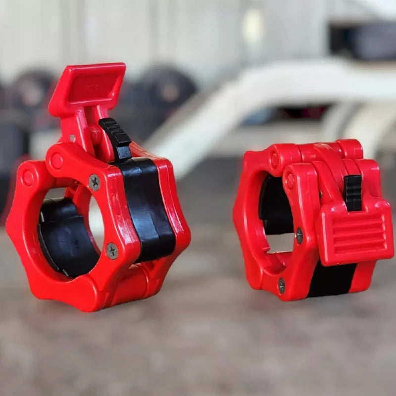 Two red and black gym weight attachments on a blurred background