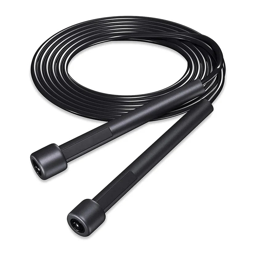 Black jump rope coiled on a white background