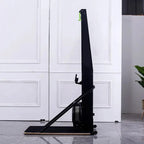 Black exercise bike against a white paneled wall