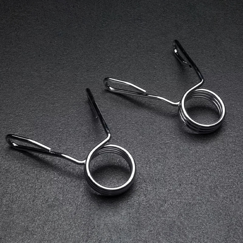 Two Olympic 2 inch spring collars on a dark grey background