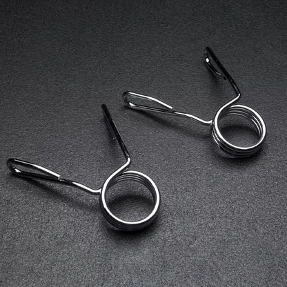 Two Olympic 2 inch spring collars on a dark grey background