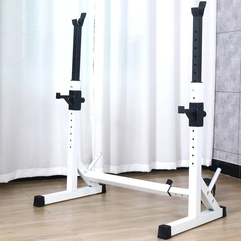 White and black weight lifting bench with adjustable bars on a wooden floor.
