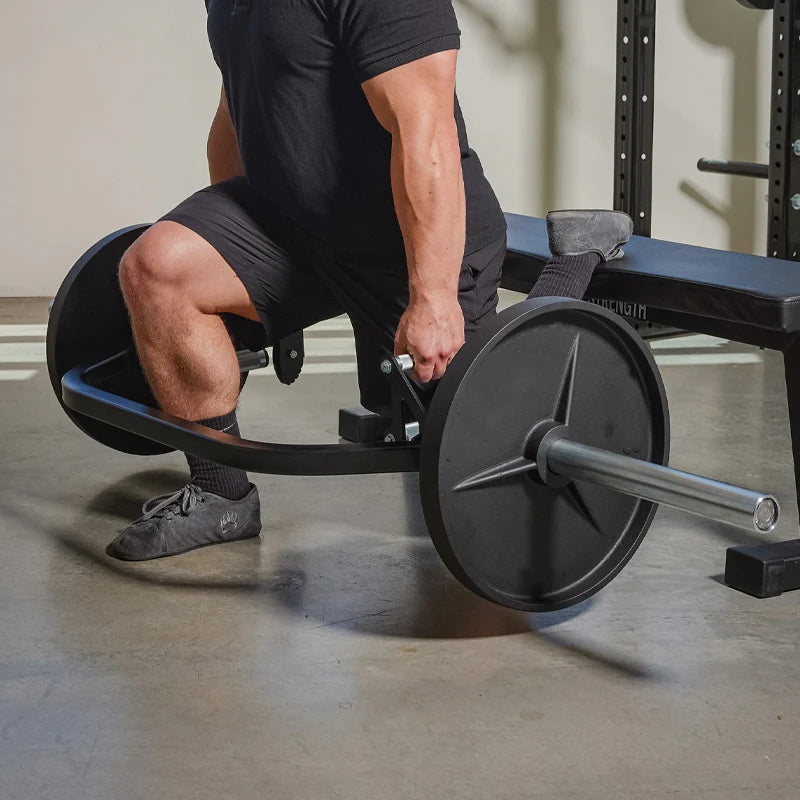 Person performing a barbell exercise in a gym setting