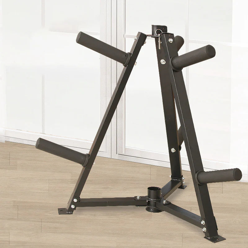 Black weight lifting bench on a wooden floor with white walls