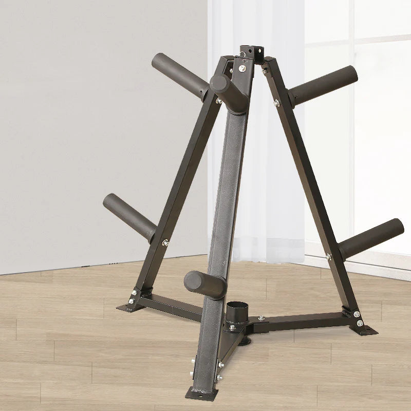 Black weight lifting bench on a wooden floor with white walls