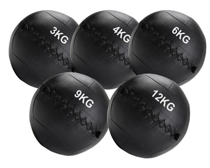 Set of five black weighted medicine balls with labeled weights on a white background