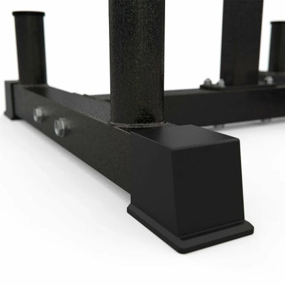 Black metal squat rack on a white background