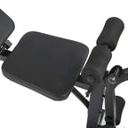 Black exercise device with seat and handles on a white background